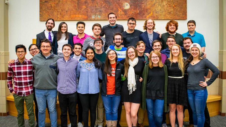 A group of people gathered together for a group photograph.