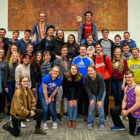 A large group of people gathered together to take a group portrait.