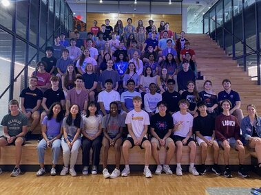 Group of students sitting inside Hudl headquarters