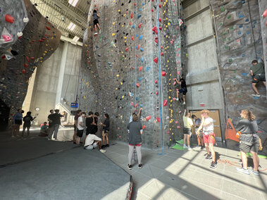 students rock climbing inside a facility