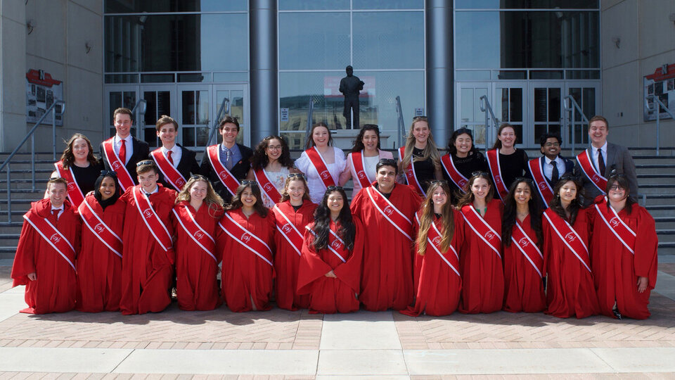 Thirteen students were inducted into the Innocents Society during Ivy Day ceremonies April 5. The new members (front row) are pictured here with the 2024-25 members (back row).